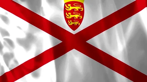 Waving flag of Jersey featuring a red diagonal cross on white background wi.. Video stock 343582826