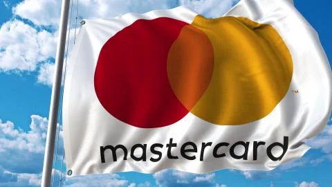 Waving flag with Mastercard logo against sky and clouds. Editorial 3D rendering イラスト素材