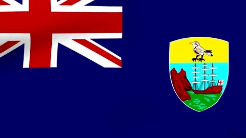 Waving flag of Saint Helena featuring a blue background and a detailed embl.. 库存影片 346546135