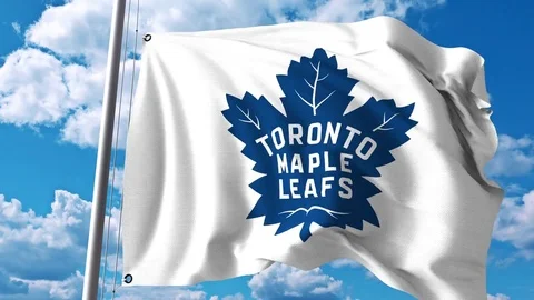 Waving flag with Toronto Maple Leafs NHL hockey team logo. 4K editorial clip Stock Footage 76986981