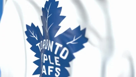 Waving flag with Toronto Maple Leafs NHL hockey team logo, close-up. Editorial Stock Footage 114468681