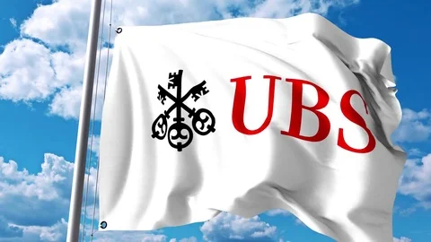 Waving flag with UBS Group AG logo against clouds and sky. 4K editorial Stock Footage 80738684