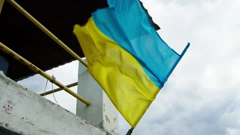 Waving flag of Ukraine the background of the sky. 4K, slow motion, high quality Video stock 178554638
