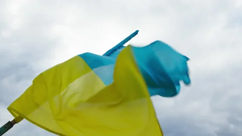 Waving flag of Ukraine on the background of the sky. 4K slow motion high quality Video stock 178557215