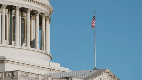 Waving Flag on U.S. Capitol Building with Blue Sky Vídeos de archivo 319675589
