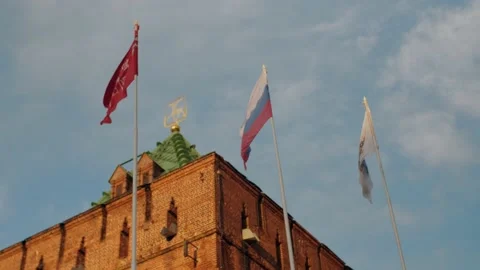 Waving flags at the background of the Dmitriev tower, Nizhny Novgorod Kremlin Stock Footage 148210588