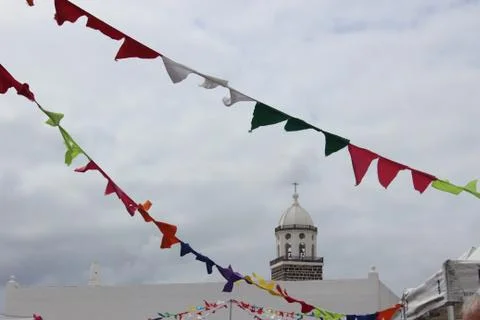 Waving flags with chruch in the backround Foto stock