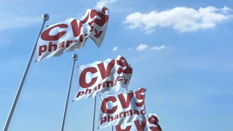 Waving flags with Cvs Pharmacy logo against sky, editorial 3D rendering Stock Illustration