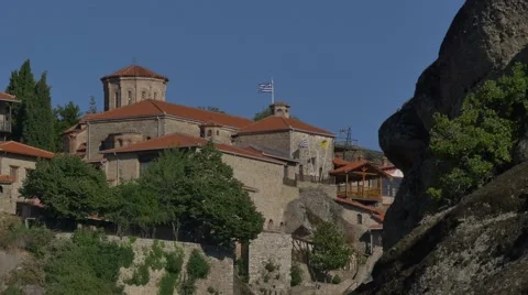 Waving flags on the Great Meteoron Monastery in Meteora, Greece in the morning Stock Footage 67718149