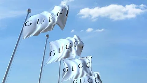 Waving flags with Gucci logo against sky, editorial 3D rendering Stock Illustration