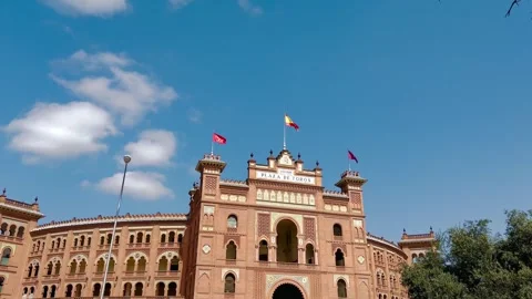 Waving flags over Bullring Las Ventas in Madrid Stock Footage 268407546