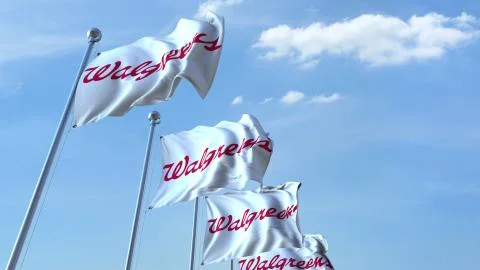 Waving flags with Walgreens logo against sky, editorial 3D rendering Stock Illustration
