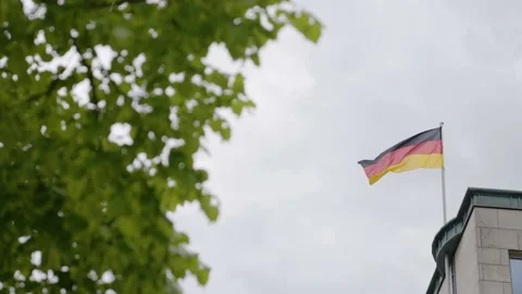 Waving German flag on top of a building Stock Footage 158070295