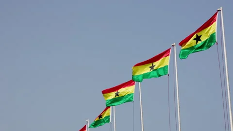 Waving Ghana flags against blue skies on a sunny day. Video stock 346104464