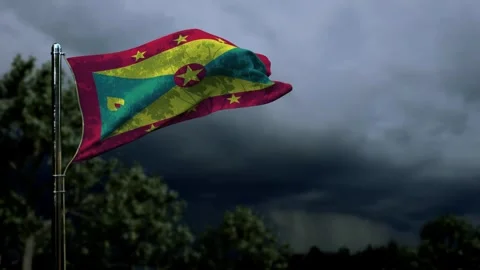 Waving Grenada flag for anthem day on dark storm clouds Video stock 241520112