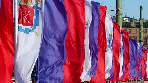 Waving holiday flags on the Palace bridge in Saint Petersburg Stock Footage 274387986