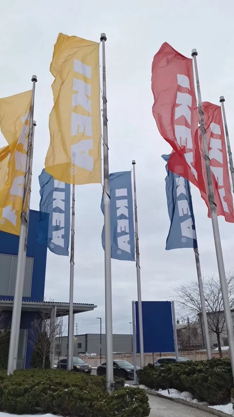 Waving Ikea store flags on a cloudy day Stock Footage 326168434
