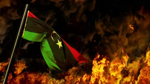 Waving Libya flag on burning fire bg - crysis concept Stock Footage 187985904