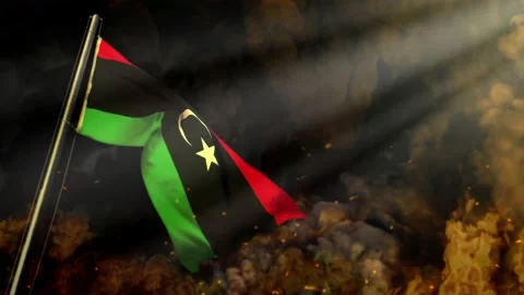 Waving Libya flag on smoke and fire with sun beams - problem concept Stock Footage 195980225