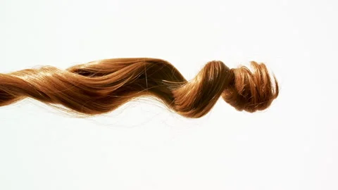 Waving of locks of brown bunch shiny wavy hair. Slow Motion. Hair care and Stock Footage 255674190
