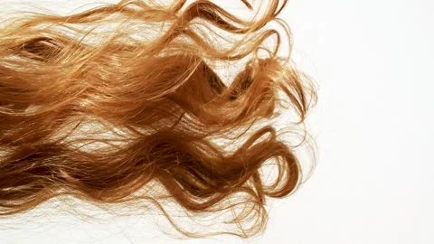 Waving of locks of brown bunch shiny wavy hair. Slow Motion. Hair care and Stock Footage 270934577