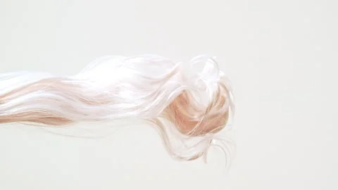 Waving of locks of pink shiny wavy bunch hair. Slow Motion. Hair care and beauty Stock Footage 265902142