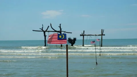 Waving Malaysia Flag At The Beach Stock Footage 202291711