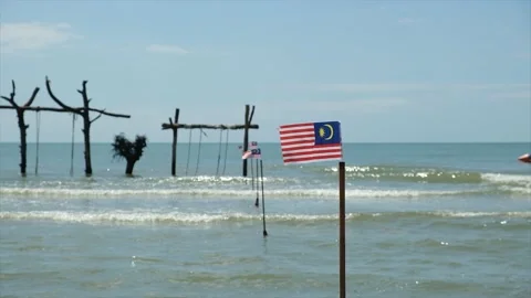 Waving Malaysia Flag At The Beach Stock Footage 202291720