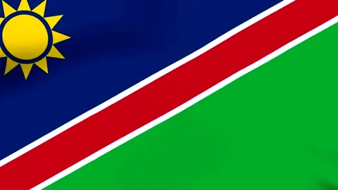 Waving national flag of Namibia featuring yellow sun on blue and green back.. Stock Footage 346546578