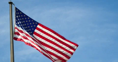 Waving Old Glory in a Patriotic Display Stock Footage 240690585