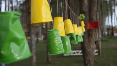 Waving or moving handcrafts made of plastic glass in the park Stock Footage 168366139
