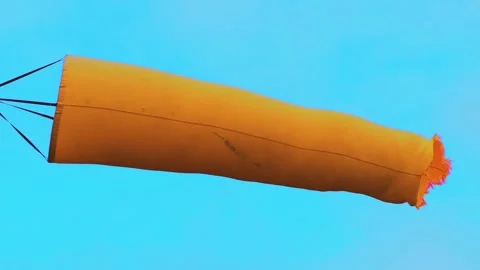 Waving Orange Wind Sock, Clear Sky, Slow Motion, Loop Stock Footage 156397100