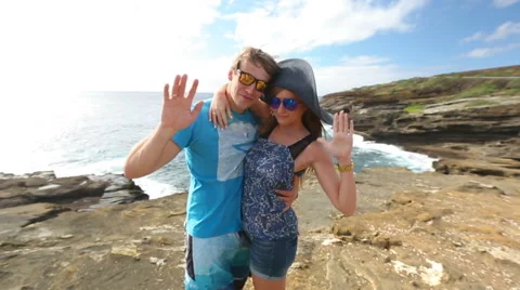 Waving people saying hello with hand on Lanai lookout, Oahu, Hawaii Stock Footage 58144963