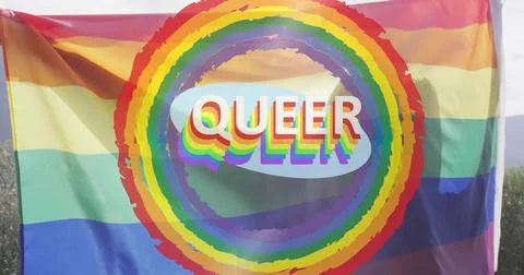 Waving rainbow pride flag showing ringed rainbow and 3D QUEER on hill, with Stock Illustration