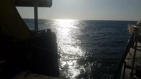 Waving sea during sunset, view from moving ship Stock-Footage 138595194