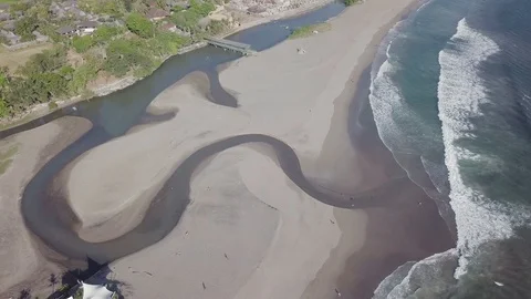 Waving stream on the sand beach top down view aerial footage Stock Footage 100692272