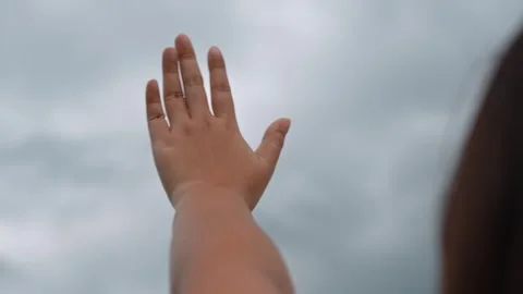 Waving towards heavy storm clouds and an approaching rainstorm. Stock Footage 316568054