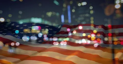 Waving translucent American flag overlaying night city skyline, with bokeh and Stock Illustration