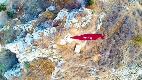 Waving Turkish flag - Image of waving Turkish flag taken by drone Stock Footage 309111844