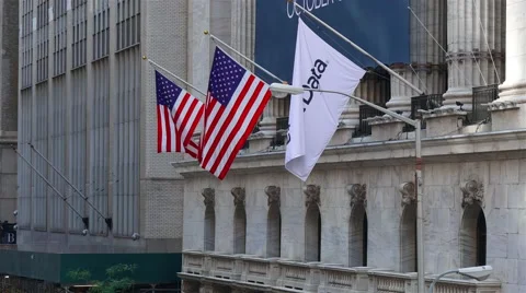 Waving US flags at the building of New York Stock Exchange in New York. Stock Footage 62834228