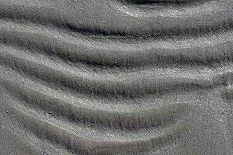 Wavy beach sand background, horizontal waves, close up Stock Photos