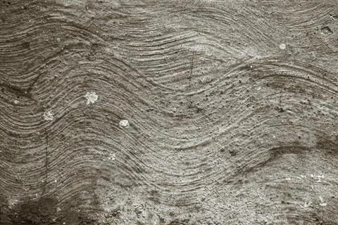 Wavy concrete texture creating rhythmic abstract background. Stock Photos