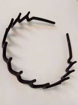 Wavy Edge Chic: A Black Acrylic Headband Stock Photos