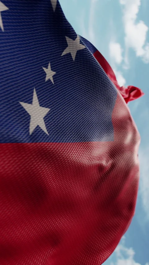 Wavy flag of Samoa blowing in the wind in slow motion. Waving official Samoan 動画素材 288432387