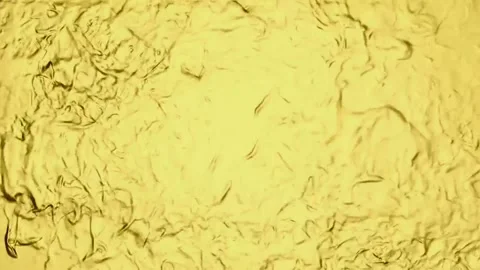 Wavy gold background with smooth, abstract gradation. Holographic gold fluid Stock Footage 157396570
