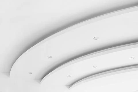 Wavy lines form three dimensional gypsum ceiling, interior design element Stock Photos