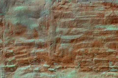 Wavy old red wall, surface with damaged plaster Stock Photos