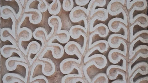 Wavy pattern of flower made on marble wall, close up handheld view Stock Footage 172469503