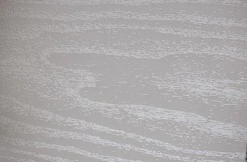 Wavy pattern of natural light wood with a bright silvery shade. Stock Photos