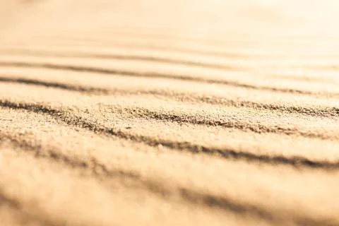 Wavy pattern sandy texture of clean beach sand surface. Coastline travel back Stock-Fotos